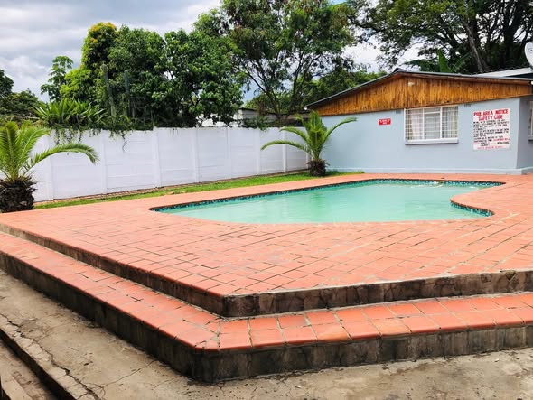 Swimming pool and terracotta pool deck